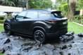 It comes finished in a matte black exterior paint shade which looks quite sinister. Tata Harrier EV Stealth Edition rear quarter